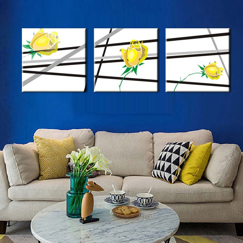 Yellow Flowers, Black Lines - Modern 3-panel canvas wall art featuring minimalist yellow roses with bold black intersecting lines on white background, perfect for contemporary home decor and living room walls