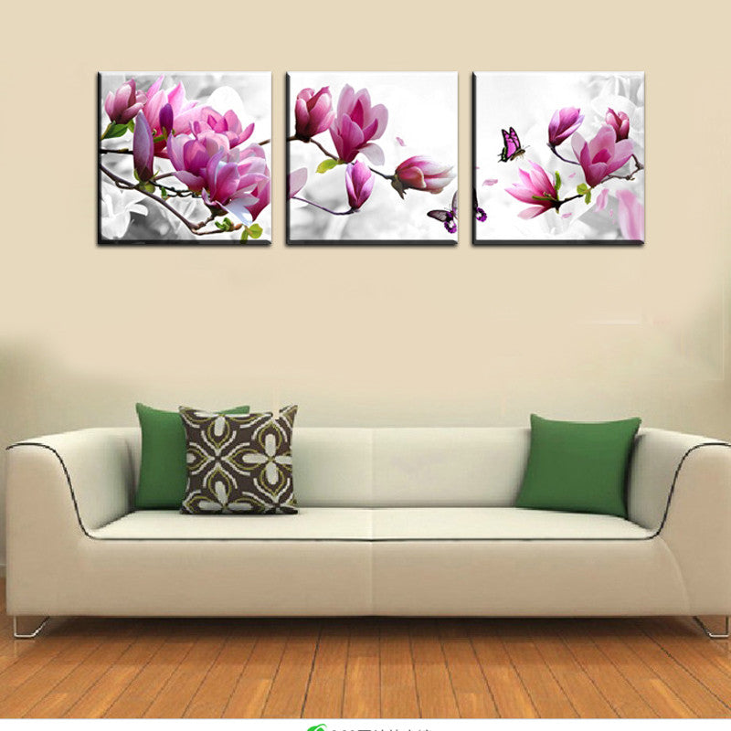 Flowers and Butterflies - Three-panel canvas wall art featuring vibrant pink magnolia blossoms and purple butterflies on white background, perfect for modern home decor and living room walls