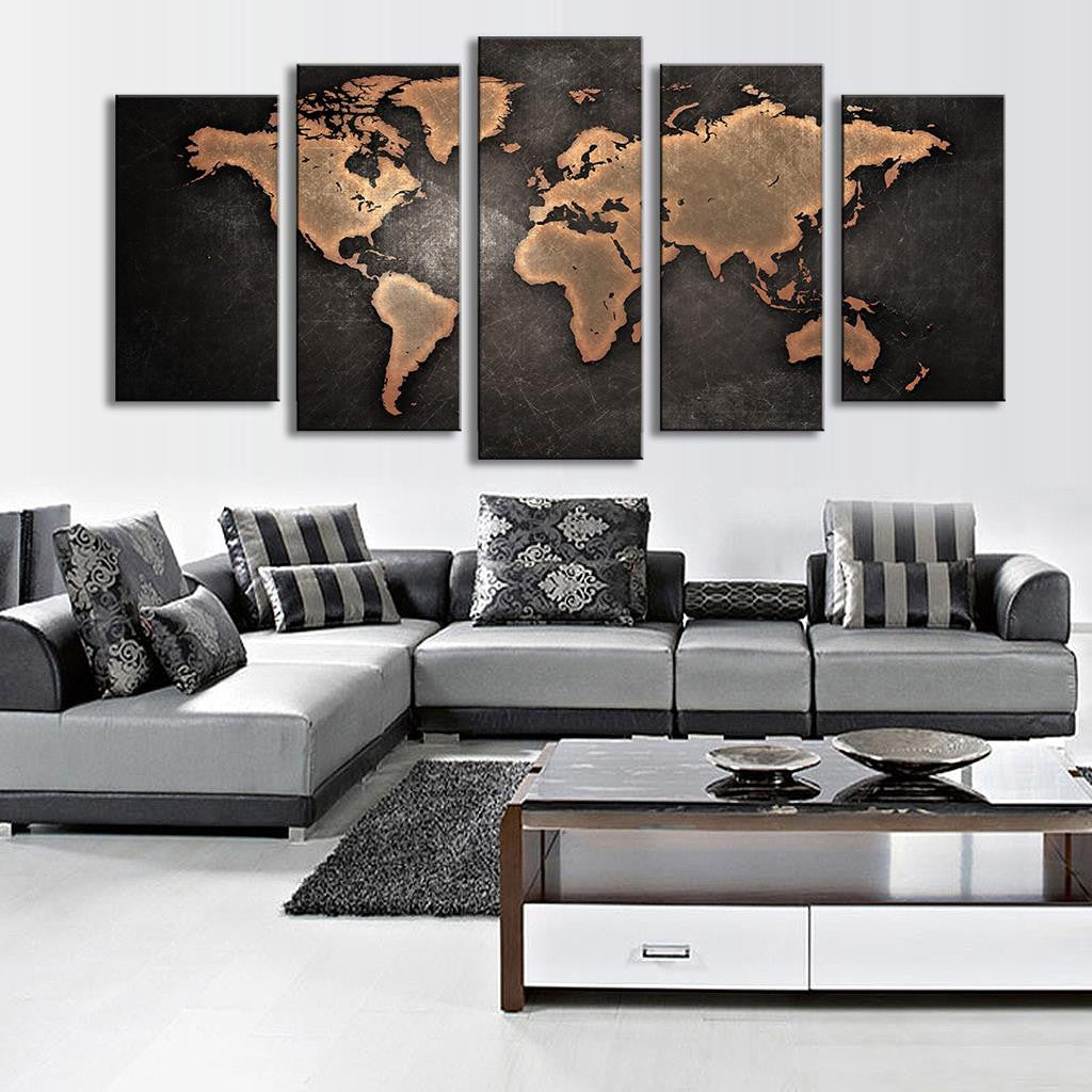 World Map in Black and Brown: 5-panel canvas wall art featuring a vintage-style world map with copper-brown continents on a textured black background, displayed above a modern grey sectional sofa