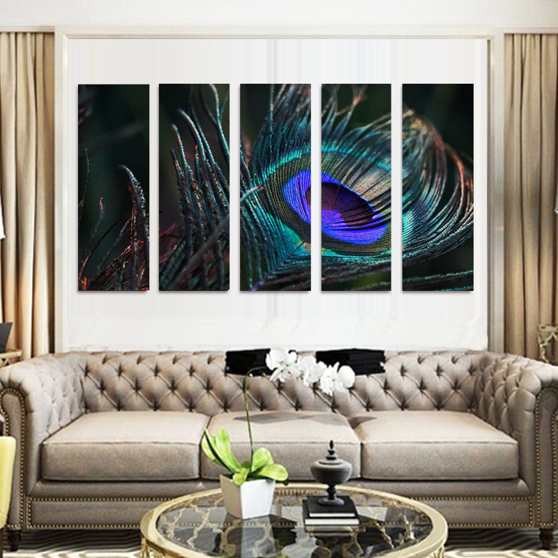 Peacock Feather: 5-panel canvas wall art displaying vibrant macro close-up of a peacock feather's iridescent eye pattern in blue, green, and purple tones mounted above gray tufted sofa