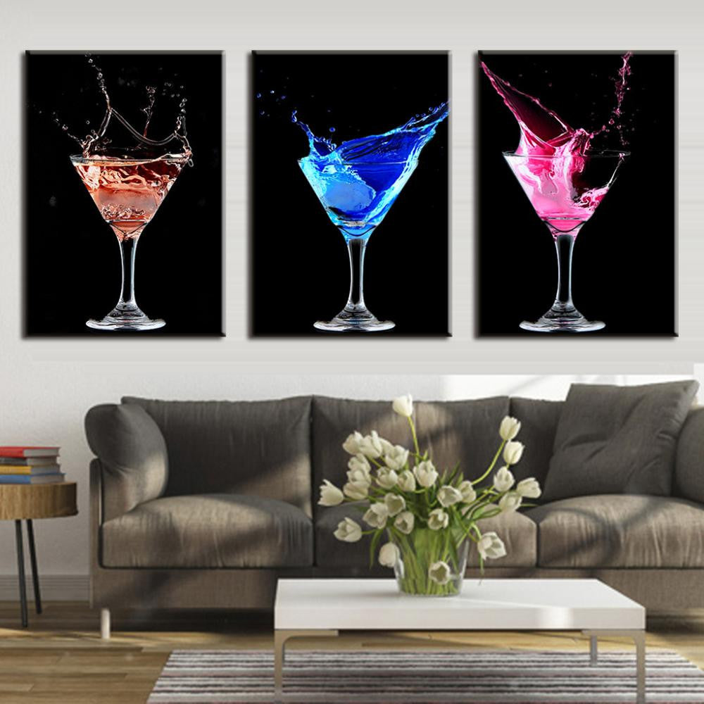 Colorful Cocktails wall art featuring three dramatic martini glasses with splashing liquids in red, blue, and pink against black backgrounds, perfect for bar or dining room decor